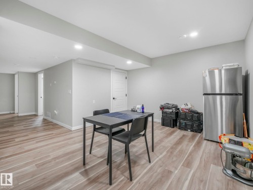 This area features light-toned flooring, recessed lighting, and neutral-colored walls, providing a versatile space - 2636 192 Street, Edmonton, AB - Indoor