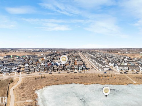 Aerial view showcasing the community with a frozen body of water and a paved path - 2636 192 Street, Edmonton, AB - Outdoor With View