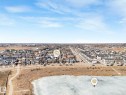 Aerial view showcasing the community with a frozen body of water and a paved path - 2636 192 Street, Edmonton, AB  - Outdoor With View 