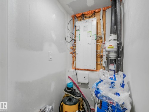 The property features a utility area with an electrical panel and visible piping - 2636 192 Street, Edmonton, AB - Indoor
