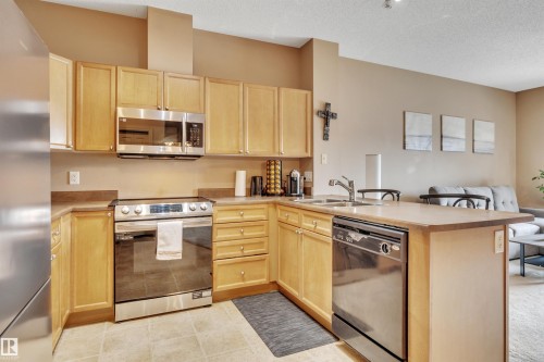 211 226 Macewan Road, Edmonton, AB - Indoor Photo Showing Kitchen With Double Sink
