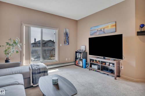 211 226 Macewan Road, Edmonton, AB - Indoor Photo Showing Living Room