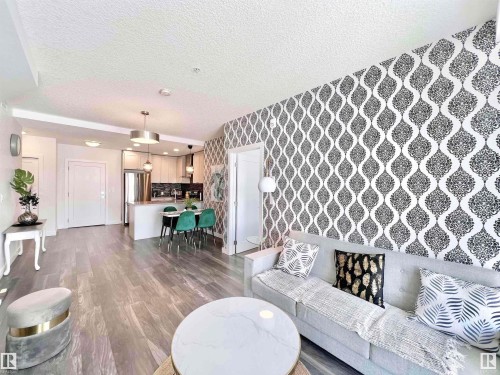 319 1316 Windermere Way, Edmonton, AB - Indoor Photo Showing Living Room