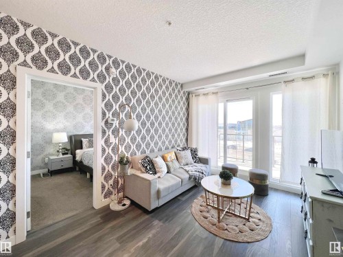 319 1316 Windermere Way, Edmonton, AB - Indoor Photo Showing Living Room