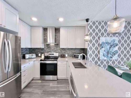 319 1316 Windermere Way, Edmonton, AB - Indoor Photo Showing Kitchen With Stainless Steel Kitchen With Double Sink With Upgraded Kitchen