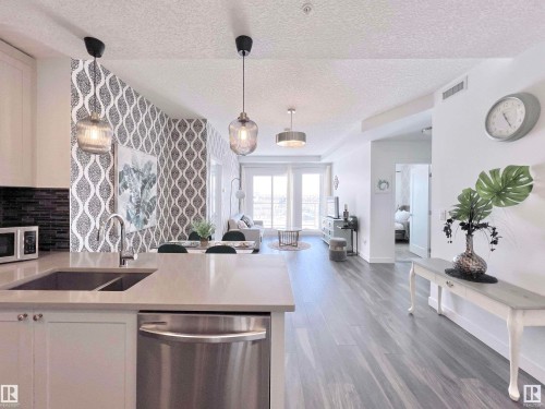319 1316 Windermere Way, Edmonton, AB - Indoor Photo Showing Kitchen With Double Sink