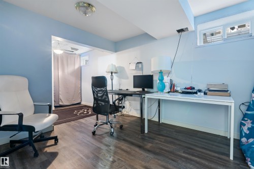 This versatile space features a window, recessed lighting, and wood-style flooring - 101 Westridge Road, Edmonton, AB - Indoor Photo Showing Office