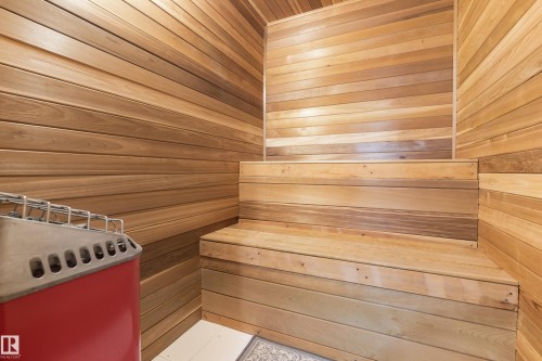 The property features a sauna with natural wood paneling, tiered wooden benches, and a red heating unit - 101 Westridge Road, Edmonton, AB - Indoor Photo Showing Other Room