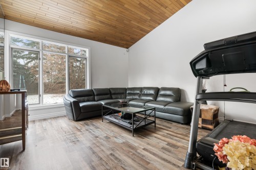 This spacious interior room features large windows and hardwood flooring - 101 Westridge Road, Edmonton, AB - Indoor Photo Showing Living Room