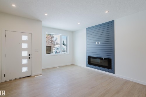 9707 157 St Nw, Edmonton, AB - Indoor Photo Showing Living Room With Fireplace