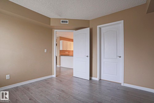 This room features neutral wall tones, light-colored flooring, and white trim - 201 10909 103 Avenue Nw, Edmonton, AB - Indoor Photo Showing Other Room