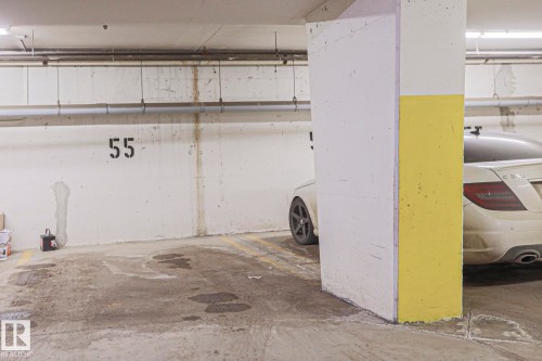 Designated parking space within a parking garage - 201 10909 103 Avenue Nw, Edmonton, AB - Indoor Photo Showing Garage