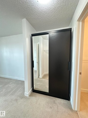 311 667 Watt Boulevard, Edmonton, AB - Indoor Photo Showing Other Room