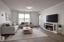 311 667 Watt Boulevard, Edmonton, AB  - Indoor Photo Showing Living Room With Fireplace 