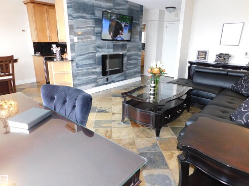 1704 10150 117 Street, Edmonton, AB - Indoor Photo Showing Living Room With Fireplace