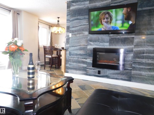 1704 10150 117 Street, Edmonton, AB - Indoor Photo Showing Living Room With Fireplace