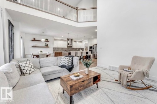 Open concept living space with high ceilings and light-colored walls - 1407 Graydon Hill Way, Edmonton, AB - Indoor Photo Showing Living Room