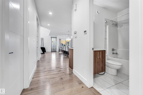 This property features light wood flooring, white walls, and recessed lighting - 1407 Graydon Hill Way, Edmonton, AB - Indoor Photo Showing Bathroom