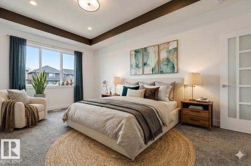 This bedroom features a coffered ceiling, recessed lighting, and a large window with privacy curtains - 1407 Graydon Hill Way, Edmonton, AB - Indoor Photo Showing Bedroom