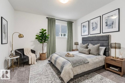 This inviting room features a plush upholstered bed with a large headboard, a window with blinds and curtains, and a soft gray patterned rug - 1407 Graydon Hill Way, Edmonton, AB - Indoor Photo Showing Bedroom
