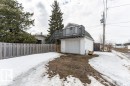 Detached garage with a second-story deck featuring a railing and an external staircase - 8 Duke Drive, Lamont, AB  - Outdoor 