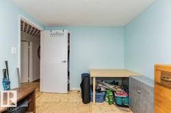 Room featuring light blue walls and a white door with a silver handle - 