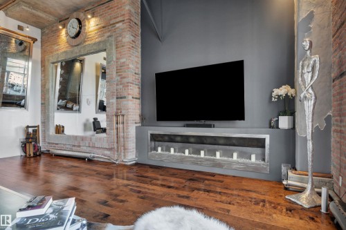 1004 10179 105 Street, Edmonton, AB - Indoor Photo Showing Living Room With Fireplace