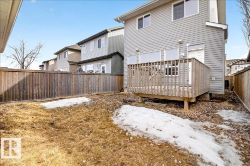The property features a wooden deck with a privacy fence, and a yard - 1530 Chapman Way, Edmonton, AB - Outdoor