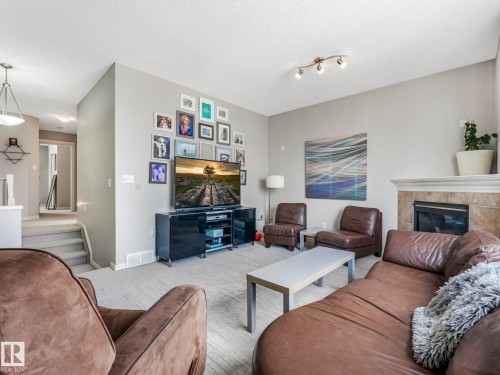 2354 Taylor Close, Edmonton, AB - Indoor Photo Showing Living Room With Fireplace