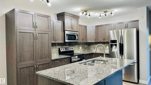1105 33A Street, Edmonton, AB - Indoor Photo Showing Kitchen With Stainless Steel Kitchen With Double Sink With Upgraded Kitchen