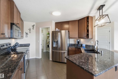 1247 Westerra Crescent, Stony Plain, AB - Indoor Photo Showing Kitchen With Double Sink