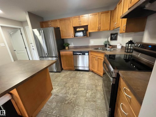 1302 9363 Simpson Drive, Edmonton, AB - Indoor Photo Showing Kitchen With Stainless Steel Kitchen With Double Sink