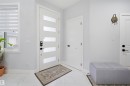 Entryway featuring a modern door with horizontal frosted glass panels, white tiled flooring, and light gray walls - 2420 13 Avenue, Edmonton, AB  - Indoor Photo Showing Other Room 