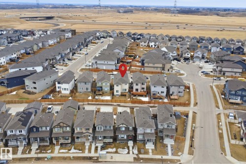 Aerial view of the property and its surrounding residential neighborhood with roads and houses - 2420 13 Avenue, Edmonton, AB - Outdoor With View