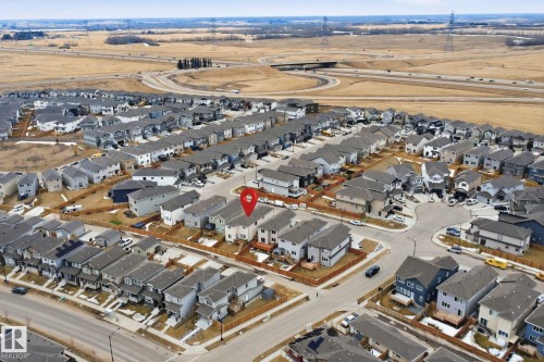 Aerial view showcasing the residential neighbourhood with a variety of homes, streets, and nearby highway infrastructure - 2420 13 Avenue, Edmonton, AB - Outdoor With View