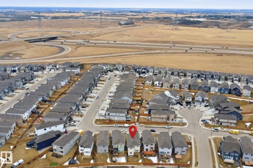 Aerial view of the property and its surrounding neighborhood, featuring residential streets, a cul-de-sac, and nearby roadways - 2420 13 Avenue, Edmonton, AB - Outdoor With View