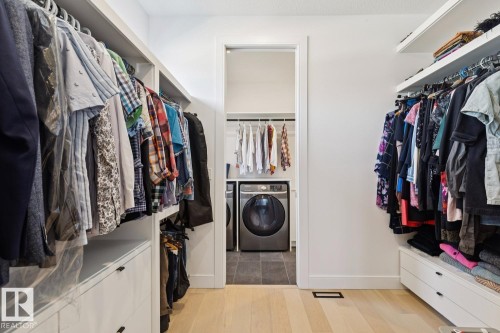 This property features a walk-in closet with built-in shelving, drawers, and hanging rods - 11146 62 Street Nw, Edmonton, AB - Indoor With Storage