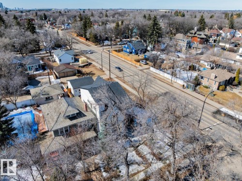 Aerial view showcasing the property's location within a neighborhood featuring mature trees and a clear sky - 11146 62 Street Nw, Edmonton, AB - Outdoor With View