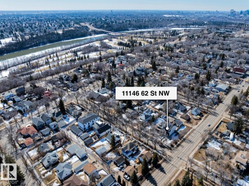 Aerial view of a residential neighborhood with a river visible in the distance - 11146 62 Street Nw, Edmonton, AB - Outdoor With View