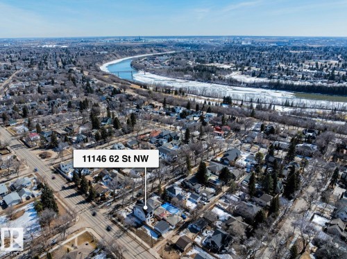 Aerial view of the property and its surrounding neighbourhood, featuring a river with a bridge - 11146 62 Street Nw, Edmonton, AB - Outdoor With View