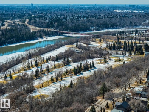 Aerial view of the surrounding area featuring a river, a bridge, and buildings in the distance - 11146 62 Street Nw, Edmonton, AB - Outdoor With View