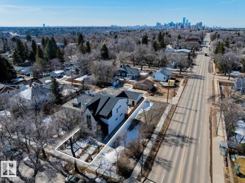 Aerial view of the property, showcasing its position along a street with a distant city skyline visible - 11146 62 Street Nw, Edmonton, AB - Outdoor With View