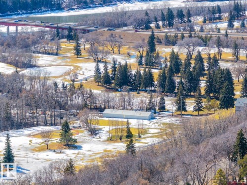 The property is located in a scenic area featuring extensive trees, open grassy spaces, and a nearby body of water - 11146 62 Street Nw, Edmonton, AB - Outdoor With View