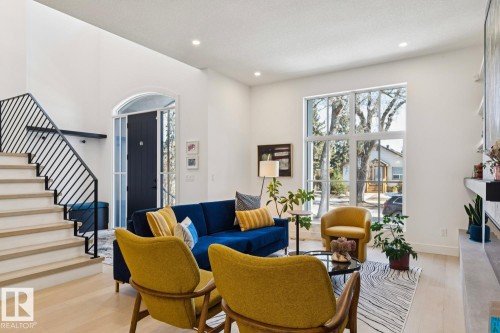 The interior features light wood floors and white walls, creating a bright and airy atmosphere - 11146 62 Street Nw, Edmonton, AB - Indoor Photo Showing Living Room