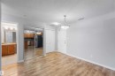 Entrance space featuring light wood-style flooring and ight grey walls. - 319 17415 99 Avenue, Edmonton, AB  - Indoor Photo Showing Other Room 