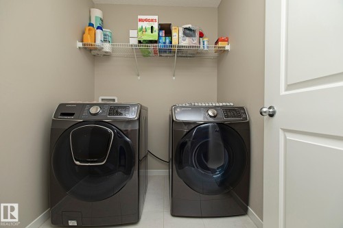 Laundry area featuring a wire shelf and light-colored walls - 7718 Eifert Crescent, Edmonton, AB - Indoor Photo Showing Laundry Room