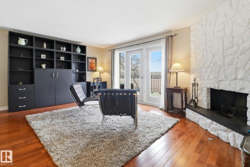9023 95 Street, Edmonton, AB - Indoor Photo Showing Living Room With Fireplace