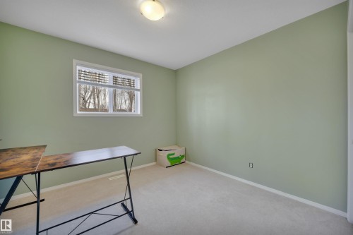 Room with light green walls, a window with horizontal blinds, and carpeted flooring - 5 Parkview Crescent, Calmar, AB - Indoor