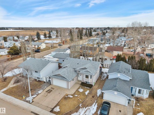 The property features a light-colored exterior, a multi-gabled roof, and an attached garage - 5 Parkview Crescent, Calmar, AB - Outdoor With View