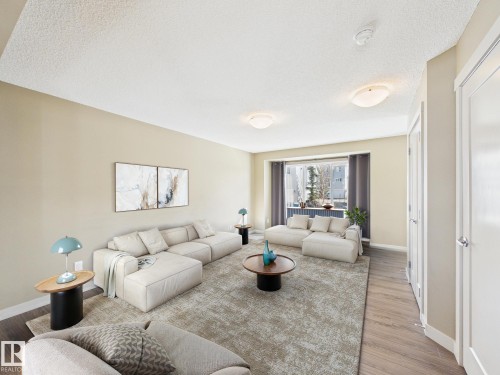 32 2121 Haddow Drive, Edmonton, AB - Indoor Photo Showing Living Room
